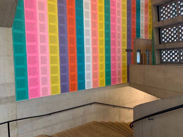 Stairwell at the Tate Modern, with Jenny Holzer's Inflammatory essays pasted on the wall